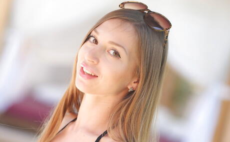 Deluxe pornstar Lina in sexy bikini baring her ass and spreading her legs at pool